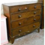 A 3' 6" 19th Century mahogany chest of two short and three long graduated drawers, set on high