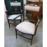 A pair of Edwardian inlaid mixed wood salon elbow chairs, with vase and scroll motifs to back