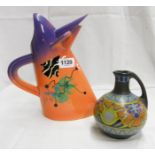A Richard Godfrey pottery jug in the form of a stylised bird with abstract decoration - sold with