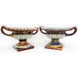 A mismatched pair of 8" 19th Century Doulton Lambeth Classical style two handled urns, both with egg