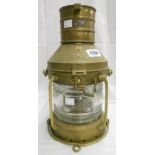 A brass oil fired ship's anchor lantern