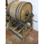 A 24 1/2" coopered butter churn by C. Hathaway, Chippenham, Wiltshire, with cast iron fittings and