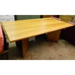 A 6' polished mixed wood retro style dining table with V-pattern standard ends