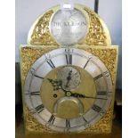An antique eight day longcase movement with 12" arched brass and silvered dial marked Dickerson of