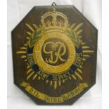 An early 20th Century stained wood wall plaque with the crest and motto of the Royal Army Service