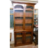 A 3' 6" 19th Century mahogany two part book cabinet with moulded cornice and four shelves enclosed