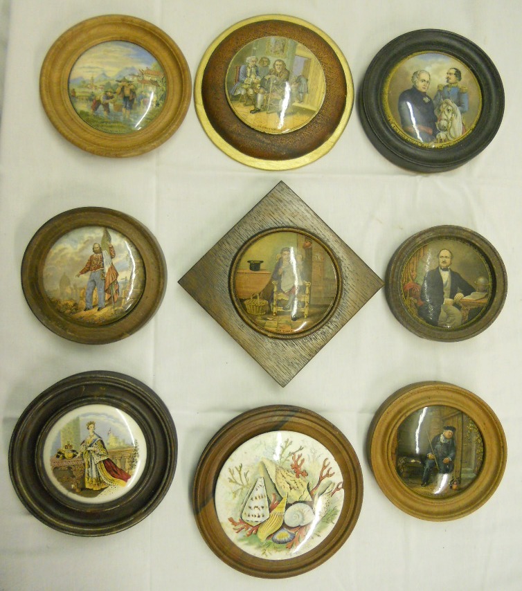 A collection of framed antique pot lids of famous people, including Dr Johnson, Queen Victoria,