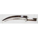 An antique Indo-Persian sword with curved and etched blade, wooden scabbard and grip with carved