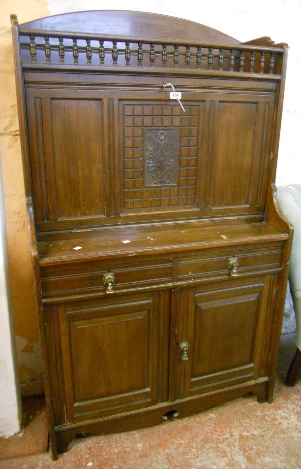 A 36" Edwardian walnut writing cabinet with spindle gallery to top, fall front writing surface