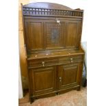 A 36" Edwardian walnut writing cabinet with spindle gallery to top, fall front writing surface