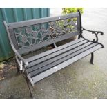 A 4' 1" garden bench with rose decorated cast metal frame and slatted seat