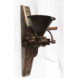 A late 18th Century American coffee grinder on bracket