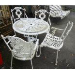 A painted aluminium garden table with allover pierced foliate decoration, set on triple cabriole