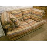 A 6' modern Chesterfield settee with Aztec palette tapestry upholstery and a selection of scatter