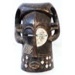 A 23" high carved African hardwood mask with downward curving (ram) horns, "coffee bean" eyes,