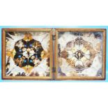 An antique wooden folding glazed case containing a geometric display of various butterflies, in