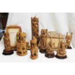 A collection of mid 20th Century Indian softwood carvings including Ganesh, Saraswati, and Krishna -