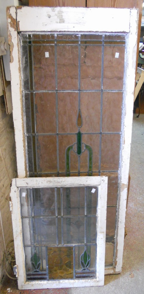 A painted pine framed leaded window with stylised stained candle on obscure pane - sold with a