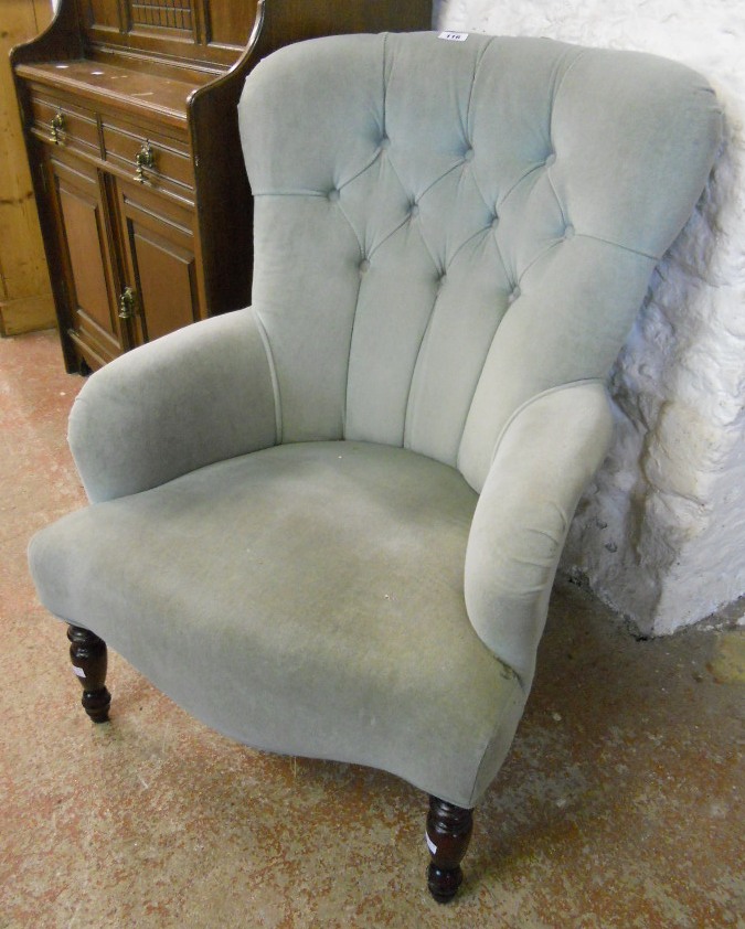 A modern button back boudoir armchair upholstered in frosted pale green draylon