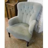 A modern button back boudoir armchair upholstered in frosted pale green draylon