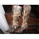 A pr of ladies high heeled zip up boots