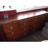 A late Victorian mahogany sideboard chest with lift-top/fall-front centre piece