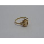 A 9CT GOLD CAMEO RING, the oval shape cameo of a woman in profile with scalloped surround with tri