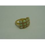A DRESS RING, designed as a cluster, stamped 925, ring size O