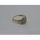 A 9CT GOLD CLUSTER RING, the single cut