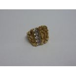 A 9CT GOLD GENTS RING, with a row of cubic zirconia to the patternated textured design, ring size S