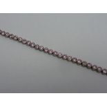 A SILVER PINK CUBIC ZIRCONIA TENNIS BRAC