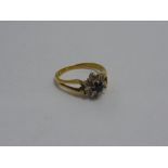 AN 18CT GOLD SAPPHIRE AND DIAMOND CLUJSTER RING, the circular shape sapphire with surround of
