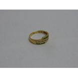 AN EMERALD AND DIAMOND RING, stamped 750, ring size M