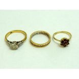 THREE RINGS, to include an 18ct gold cubic zirconia ring, a 9ct gold garnet cluster ring together