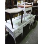 A PAINTED DESK, with four short and one long drawer and a similar piano stool (2)