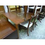 A TEAK EXTENDING DINING TABLE, and two chairs (3)