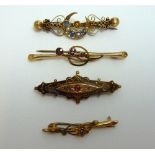 FOUR EARLY 20TH CENTURY GOLD AND GEMSET BROOCHES