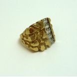 A 9CT GOLD GENTS RING, with a row of cubic zirconia to the patternated textured design, ring size S