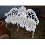 A CAST METAL THREE SEATER GARDEN BENCH