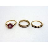 THREE RINGS, to include a 9ct gold cluster ring, a 9ct gold band ring together with another band