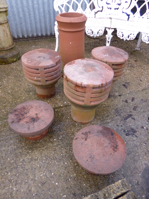 THREE TERRACOTTA CHIMNEY POT TOPS, a pair of smaller chimney pot tops and a chimney pot (6)