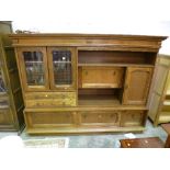 AN OAK GLAZED WALL UNIT, with two drawers and an oak corner cupboard (2)