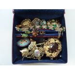 A COLLECTION OF COSTUME JEWELLERY, to include brooches, bracelets etc, within a silver plated box