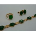 A SUITE OF JADE JEWELLERY, to include a bracelet, a ring and a pair of earrings all of the same