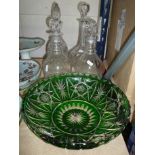 A PAIR OF CUT GLASS DECANTERS, two others and a green flashed bowl (5)