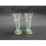 A PAIR OF CUT GLASS VASES, with silver bases, Birmingham 1973, this special silver mark used to