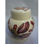 A SMALL BOXED MOORCROFT POTTERY GINGER JAR, 'Frangipani' pattern, impressed marks and dated 99,