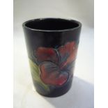 A SMALL MOORCROFT POTTERY POT, 'Hibiscus' design, height 6.5cm