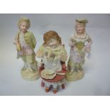 A PAIR OF CONTINENTAL BISQUE FIGURES, musician and companion and another, figure group Child with