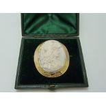 A VICTORIAN CORAL CAMEO BROOCH, depicting a Roman goddess within a 15ct gold decorative surround